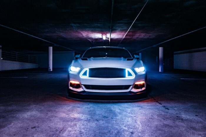 Car headlights in a dark garage